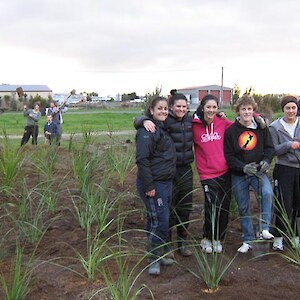 James Hargest College Environmental Group undertake planting of flax, cabbage trees, toe toe and hebe salicifolia along the west edge of Thomsons Bush. June 2011.