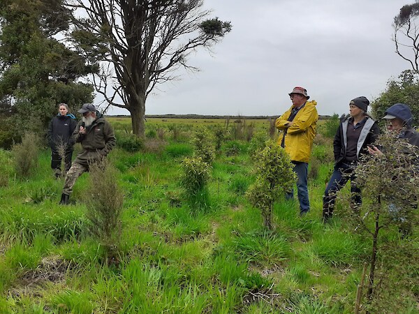 2020 SERN spring field trip. Mark Oster, Environment Southland, talks about recent revegetation plantings. He expresses his concern about all the plastic ending up in the environment with tree surrounds.