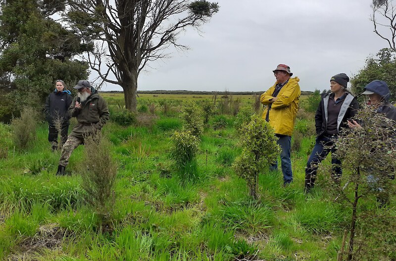 2020 SERN spring field trip. Mark Oster, Environment Southland, talks about recent revegetation plantings. He expresses his concern about all the plastic ending up in the environment with tree surrounds.